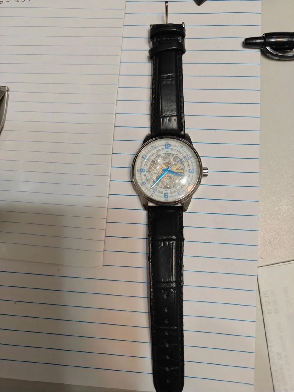 Akribos XXIV Black Leather Strap Skeleton Dial Watch with Blue Hands